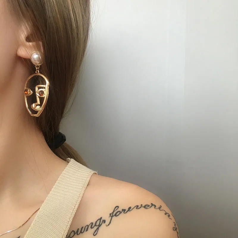 abstract hollow face drop earrings