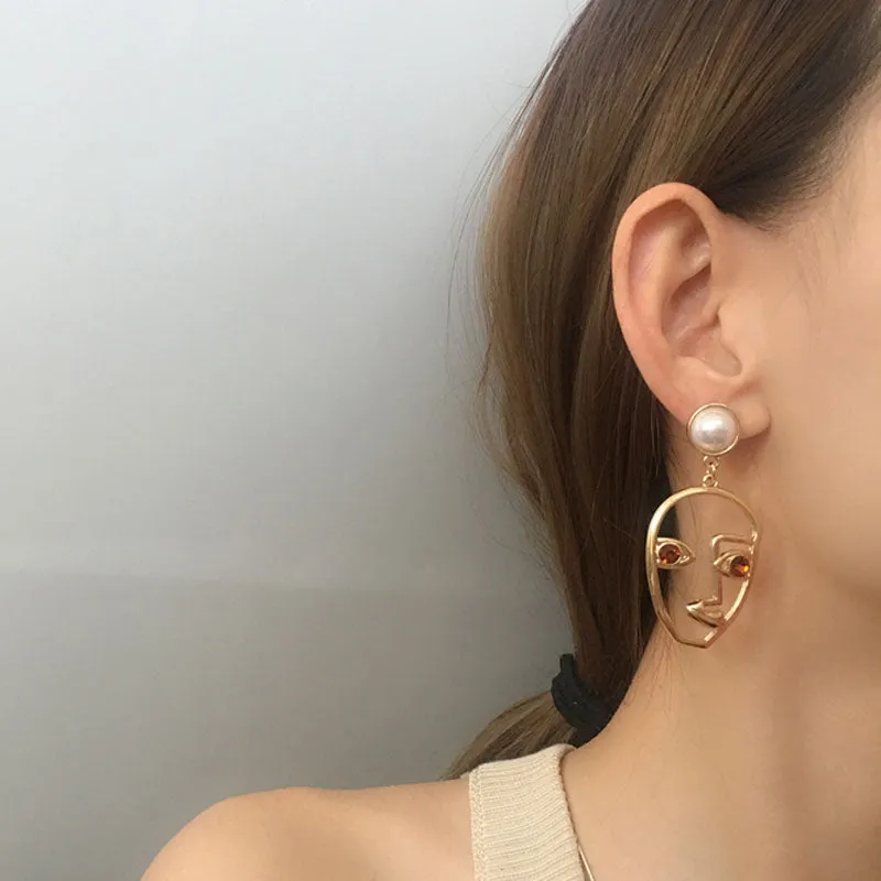 abstract hollow face drop earrings